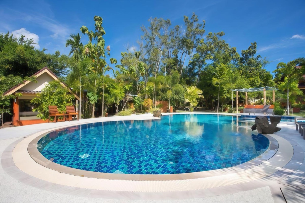 The resort's main pool, ringed by trees