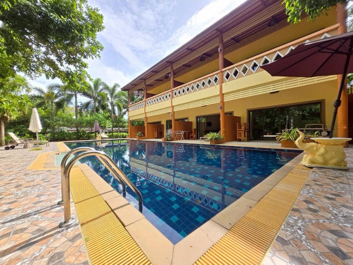 Steps and a handrail at the shallow end of the pool