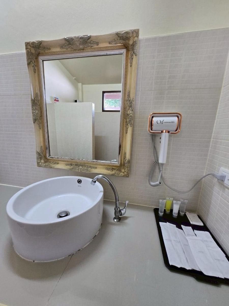 The private bathroom, with a hairdryer and toiletries